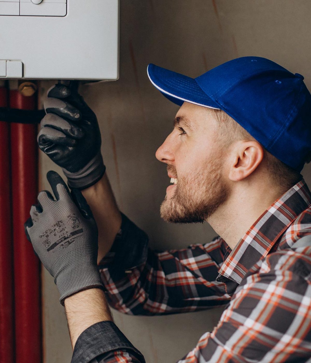 Service man adjusting house heating system